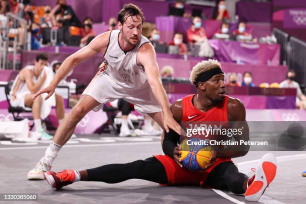 Ira Brown of Team Japan is challenged by Thierry Marien of Team Belgium during the Men's Pool Round match between Belgium and Japan on day one of the...