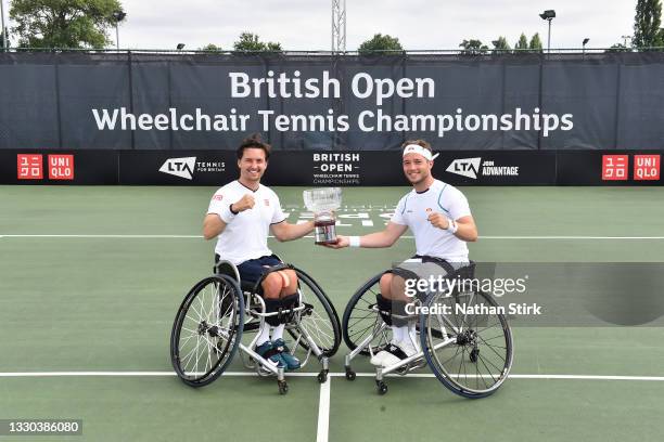 Alfie Hewett and Gordon Reid of Great Britain hold the men’s doubles British Open Wheelchair Trophy after beating Stephane Houdet and Nicolas Peifer...