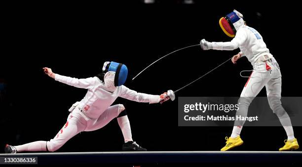 Yiwen Sun of Team China and Ana Maria Popescu of Team Romania compete in the Women’s Epee Individual gold medal bout of the fencing on day one of the...