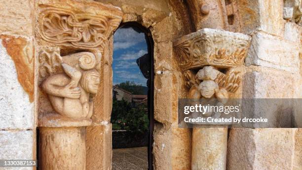 two erotic capitals in a romanesque church - phallic sculptures stock pictures, royalty-free photos & images