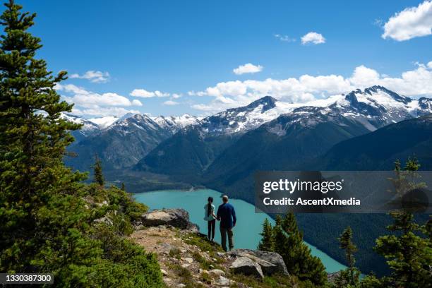 father and daughter hiking on a summer vacation - family ice nature stock pictures, royalty-free photos & images