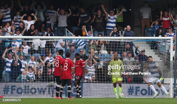 Lee Grant of Manchester United reacts to conceding a goal to Moses Odubajo of Queens Park Rangers during the pre-season friendly match between Queens...