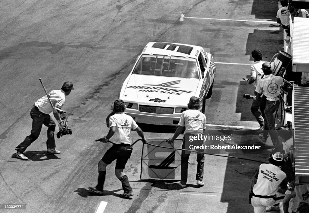 Ricky Rudd Throwback NASCAR driver Ricky Rudd makes a pit stop during the 1983 Firecracker ...