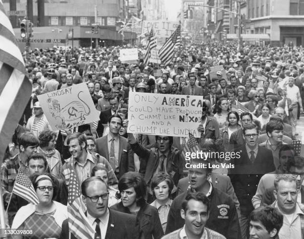 Crowd of protestors at a counter demonstration against a student rally being held in the wake of the Kent State shootings, Lower Manhattan, New York...