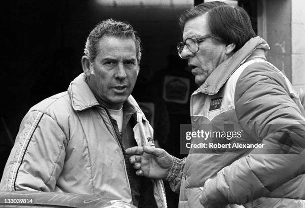 Driver David Pearson, left, talks with Bud Moore, owner of the Wrangler Jeans car driven by Dale Earnhardt Sr, in the Daytona International Speedway...