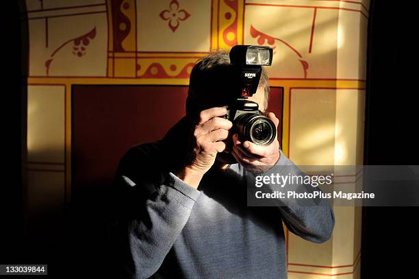 Photographer with a Canon EOS 450D camera and Sunpak PZ42X flash at Castell Coch, Cardiff, November 19, 2009.