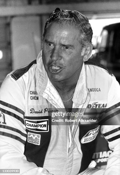 Driver David Pearson relaxes in the Daytona International Speedway garage prior to the start of the 1985 Daytona 500 on February 17, 1985 in Daytona...