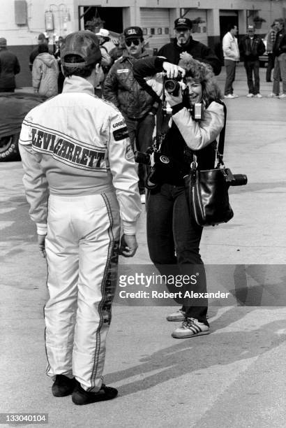 Driver Geoff Bodine poses for a photographer in the Daytona International Speedway garage area prior to the 1988 Daytona 500 on February 14, 1988 in...