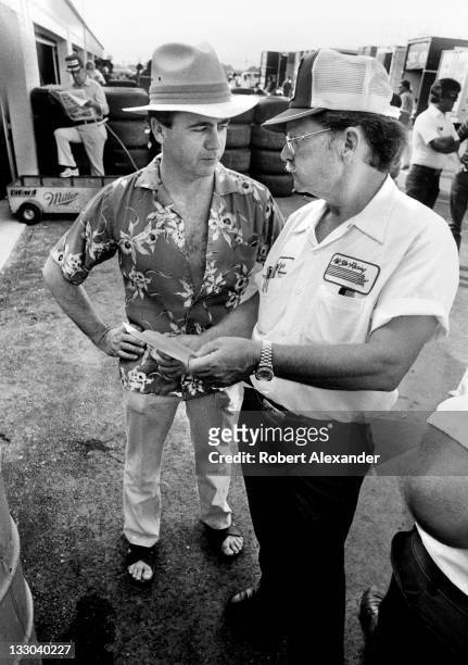 Driver Geoff Bodine, left, talks with his crew chief, Harry Hyde, in the Daytona International Speedway garage area prior to the 1984 Daytona 500 on...