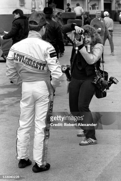 Driver Geoff Bodine poses for a photographer in the Daytona International Speedway garage area prior to the 1988 Daytona 500 on February 14, 1988 in...