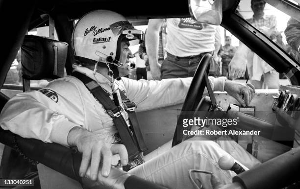 Driver Bobby Allison prepares for the start of the 1983 Firecracker 400 at the Daytona International Speedway on July 4, 1983 in Daytona Beach,...