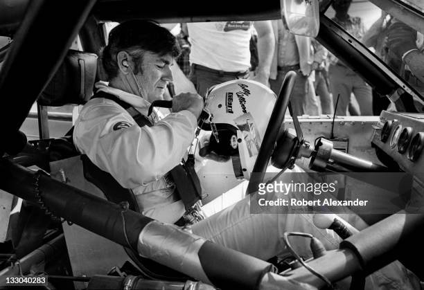 Driver Bobby Allison prepares for the start of the 1983 Firecracker 400 at the Daytona International Speedway on July 4, 1983 in Daytona Beach,...