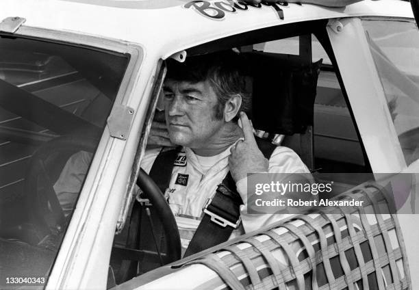 Driver Bobby Allison prepares for the start of the 1983 Firecracker 400 at the Daytona International Speedway on July 4, 1983 in Daytona Beach,...