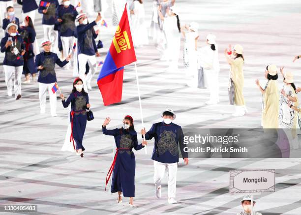 Flag bearers of Team Mongolia Khulan Onolbaatar and Duurenbayar Ulziibayarenjoy lead their delegation during the Opening Ceremony of the Tokyo 2020...
