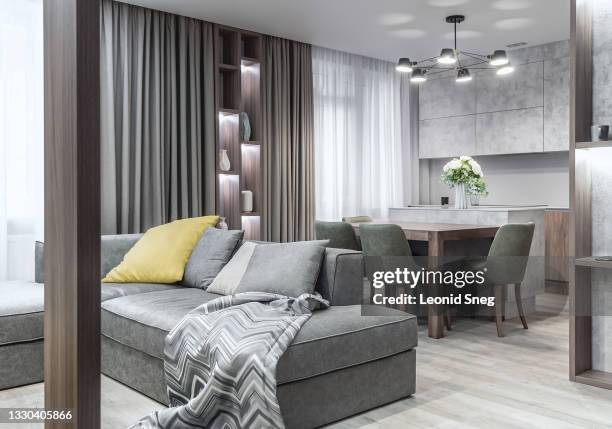 part of the living room interior side view. modern studio apartment in a bright gray scandinavian design close up - furniture showroom stock pictures, royalty-free photos & images