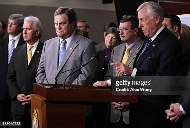 House Minority Whip Rep. Steny Hoyer takes questions as other congressional members, including Rep. Mike Simpson , Sen. Kent Conrad look on during a...