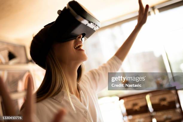 young woman wearing vr glasses - flying goggles stock pictures, royalty-free photos & images