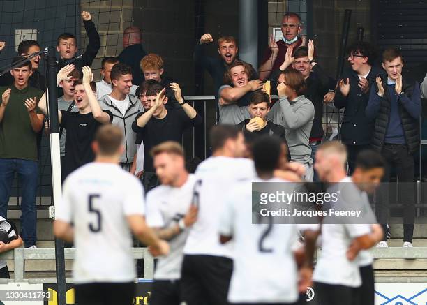 Dartford fans celebrate after George Porter of Dartford scores their teams first goal during the Pre-Season Friendly match between Dartford and AFC...