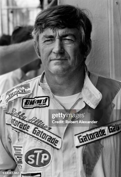 Driver Bobby Allison stands in the Daytona International Speedway garage prior to the start of the 1982 Daytona 500 on February 14, 1982 in Daytona...