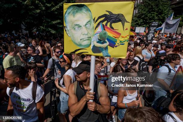 Demonstrators march during the annual Pride parade on July 24, 2021 in Budapest, Hungary. Pride organisers say that the march is as much a rally in...