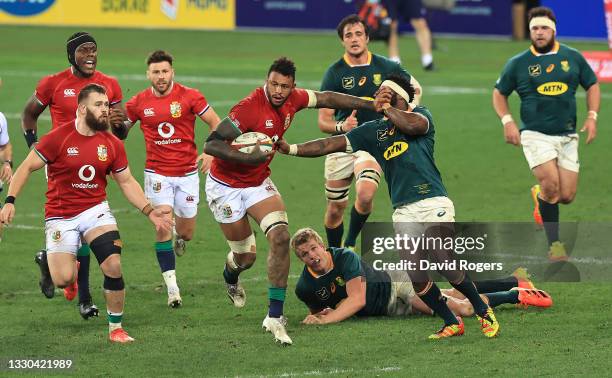 Courtney Lawes of the British & Irish Lions holds off Siya Kolisi during the 1st Test match between the South Africa Springboks and the British &...