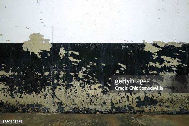 Paint is scraped away from the wall near parking space D32 in the garage underneath the Oakhill Office Building, where Washington Post reporter Bob...