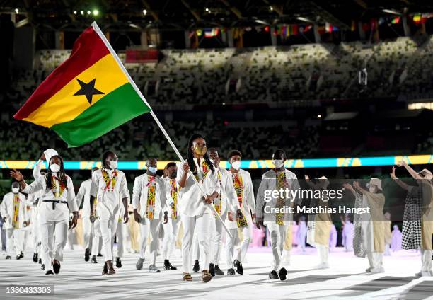 Flag bearers Nadia Eke and Sulemanu Tetteh of Team Ghana carry the flag during the Opening Ceremony of the Tokyo 2020 Olympic Games at Olympic...