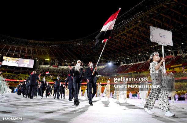 Flag bearers Hedaya Wahba and Alaaeldin Abouelkassem of Team Egypt leads their team during the Opening Ceremony of the Tokyo 2020 Olympic Games at...