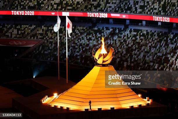 The Olympic Flame is seen during the Opening Ceremony of the Tokyo 2020 Olympic Games at Olympic Stadium on July 23, 2021 in Tokyo, Japan.