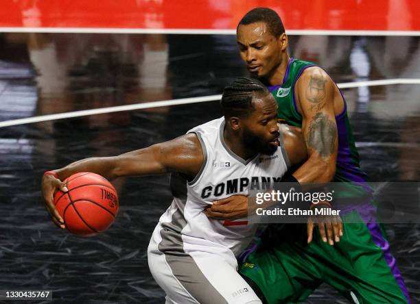 Jeremy Pargo of 3's Company drives to the basket against Rashard Lewis of 3 Headed Monsters during week three of the BIG3 at the Orleans Arena on...