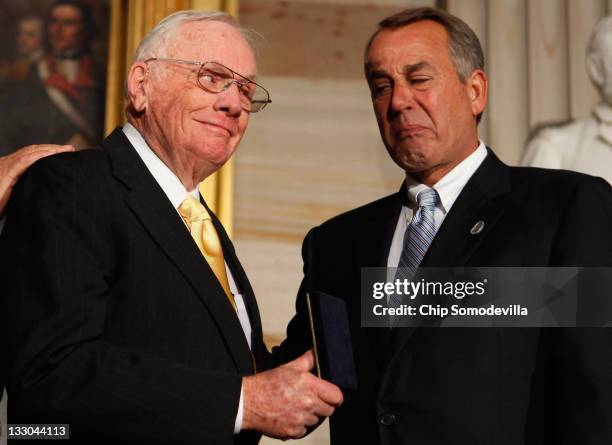 Speaker of the House John Boehner holds back tears as he presents Astronaut Neil Armstrong with the Congressional Gold Medal during a ceremony in the...