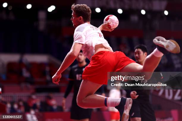 Magnus Landin of Team Denmark shoot on goal during the Men's Preliminary Round Group B match between Denmark and Japan on day one of the Tokyo 2020...