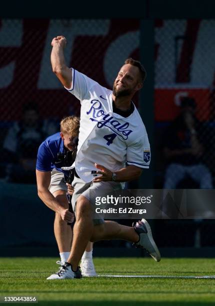 Former Kansas City Royals left fielder Alex Gordon throws out the first pitch from his former position prior to a game against the Detroit Tigers at...