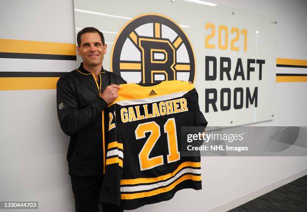 General Manager Don Sweeney of the Boston Bruins holds the jersey of the Bruins' seventh round pick Ty Gallagher, 217th overall, in the 2021 NHL...