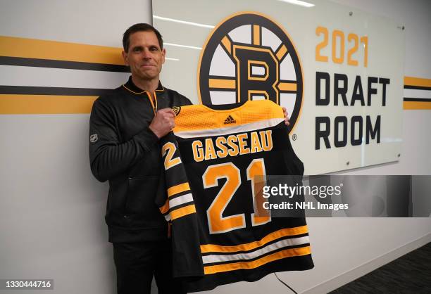 General Manager Don Sweeney of the Boston Bruins holds the jersey of the Bruins' seventh round pick Andre Gasseau, 213th overall, in the 2021 NHL...
