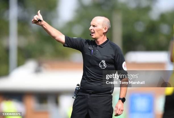 Referee Mike Dean during the Pre-Season Friendly match between Burton Albion and Leicester City at Pirelli Stadium on July 24, 2021 in...