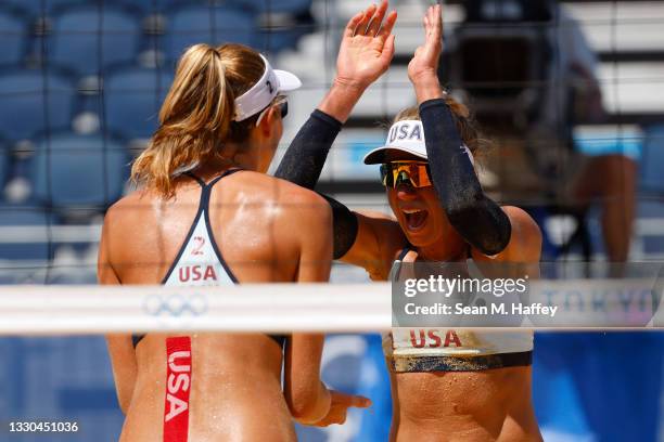 April Ross of Team United States and Alix Klineman celebrate after defeating Team China during the Women's Preliminary - Pool B on day two of the...