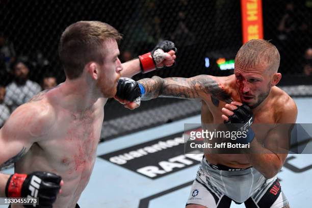 Dillashaw punches Corey Sandhagen in their bantamweight fight during the UFC Fight Night event at UFC APEX on July 24, 2021 in Las Vegas, Nevada.