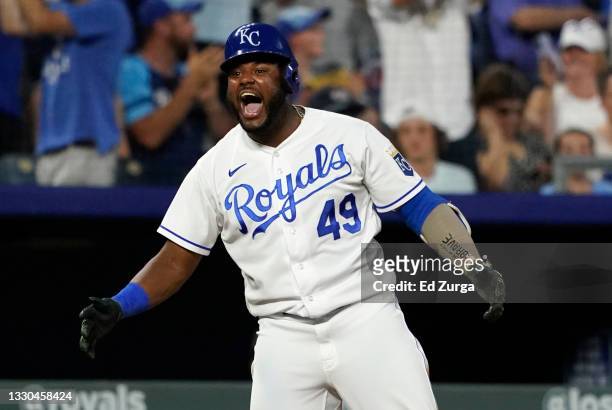 Hanser Alberto of the Kansas City Royals celebrates his two-run triple in the seventh inning against the Detroit Tigers at Kauffman Stadium on July...