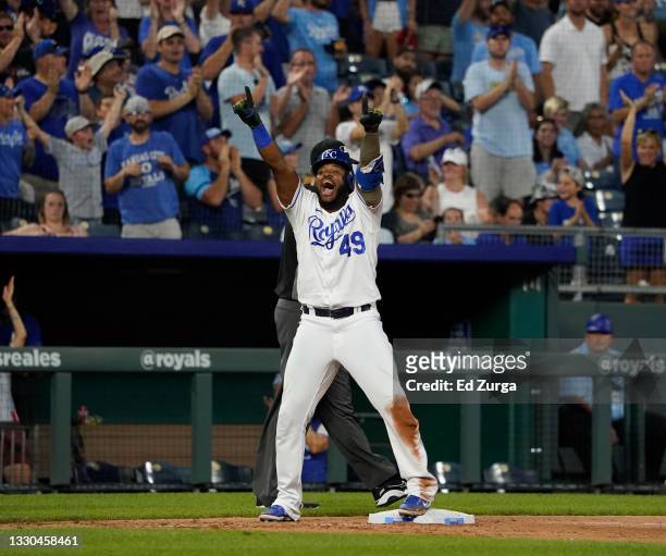 Hanser Alberto of the Kansas City Royals celebrates his two-run triple in the seventh inning against the Detroit Tigers at Kauffman Stadium on July...