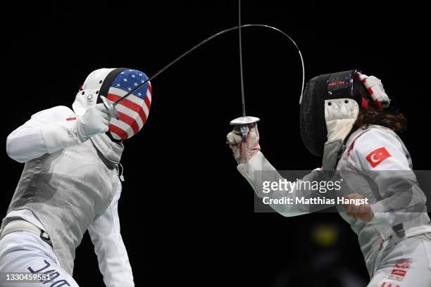 Nicole Ross of Team United States competes against Irem Karamete of Team Turkey in Women's Individual Foil first round on day two of the Tokyo 2020...
