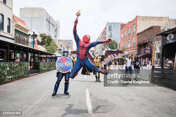 Cosplayer Derek Shackelton as Spiderman leads a parade of cosplayers down 5th Avenue at the San Diego Causeplayer Community Shrine at San Diego...