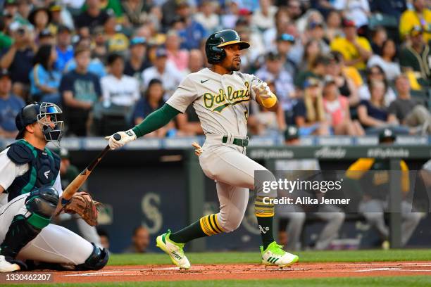 Tony Kemp of the Oakland Athletics hits a double during the first inning of the game against the Seattle Mariners at T-Mobile Park on July 24, 2021...