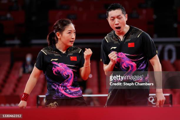 Liu Shiwen and Xu Xin of Team China in action during their Mixed Doubles Quarterfinal match on day two of the Tokyo 2020 Olympic Games at Tokyo...