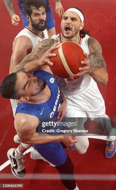 Michael Rostampour of Team Iran drives to the basket against Tomas Satoransky of Team Czech Republic during the second half on day two of the Tokyo...