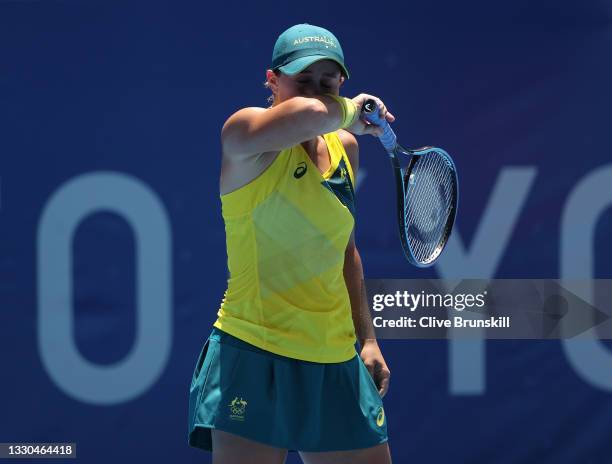 Ashleigh Barty of Team Australia feels the heat during her Women's Singles First Round match against Sara Sorribes Tormo of Team Spain on day two of...