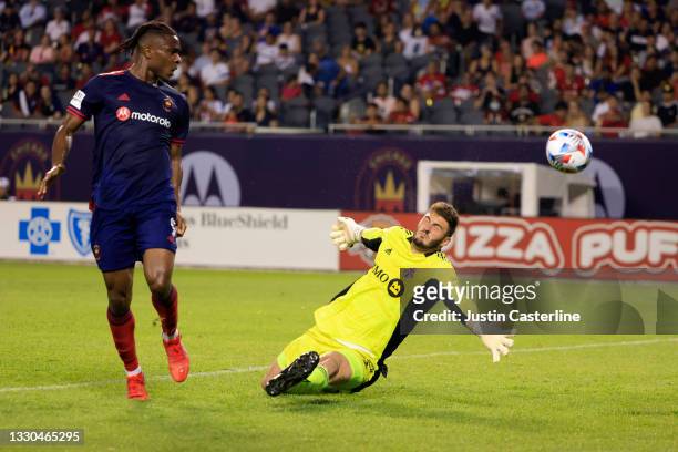 Alex Bono of Toronto FC makes a save from a shot from Chinonso Offor of Chicago Fire during the second half at Soldier Field on July 24, 2021 in...