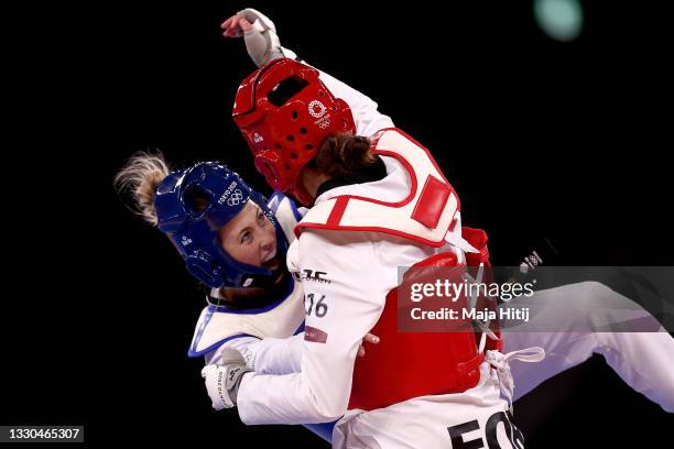 Jade Jones of Team Great Britain competes against Kimia Alizadeh Zonouzi of IOC Refugee Team during the Women's -57kg Taekwondo Round of 16 contest...