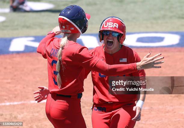 Aubree Munro and Haylie McCleney of Team United States celebrate after McCleney scored the first of the two runs in the eighth inning to win against...