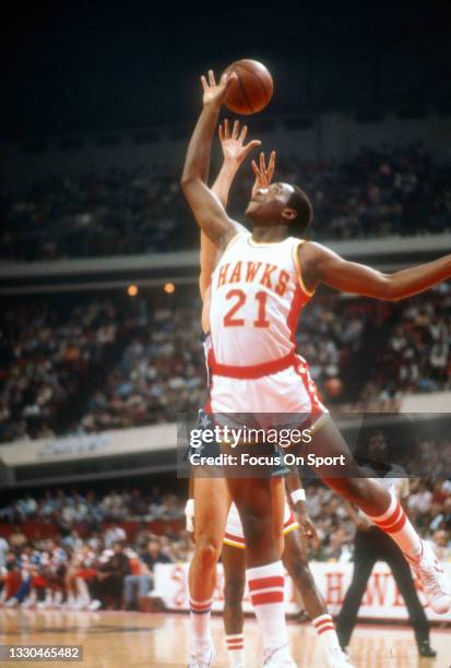 Jack Givens of the Atlanta Hawks battles for a rebound against the Washington Bullets during an NBA basketball game circa 1980 at the Omni Coliseum...